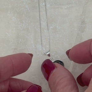 A video showing the “Always With Me” heart-shaped pet memorial pendant from all angles — front, sides, and back — highlighting craftsmanship and resin detail.