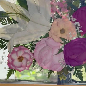 Video of floating 11x14 pressed flower art on glass, featuring preserved wedding flowers in a wood frame with natural light and movement
