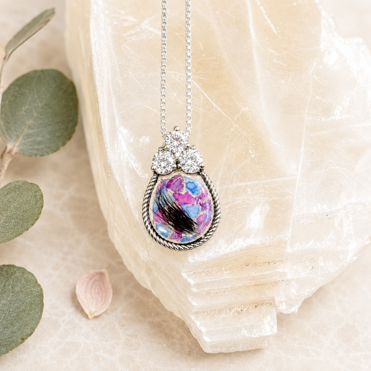 Forever in My Heart Pendant with colorful preserved flowers and a lock of hair.