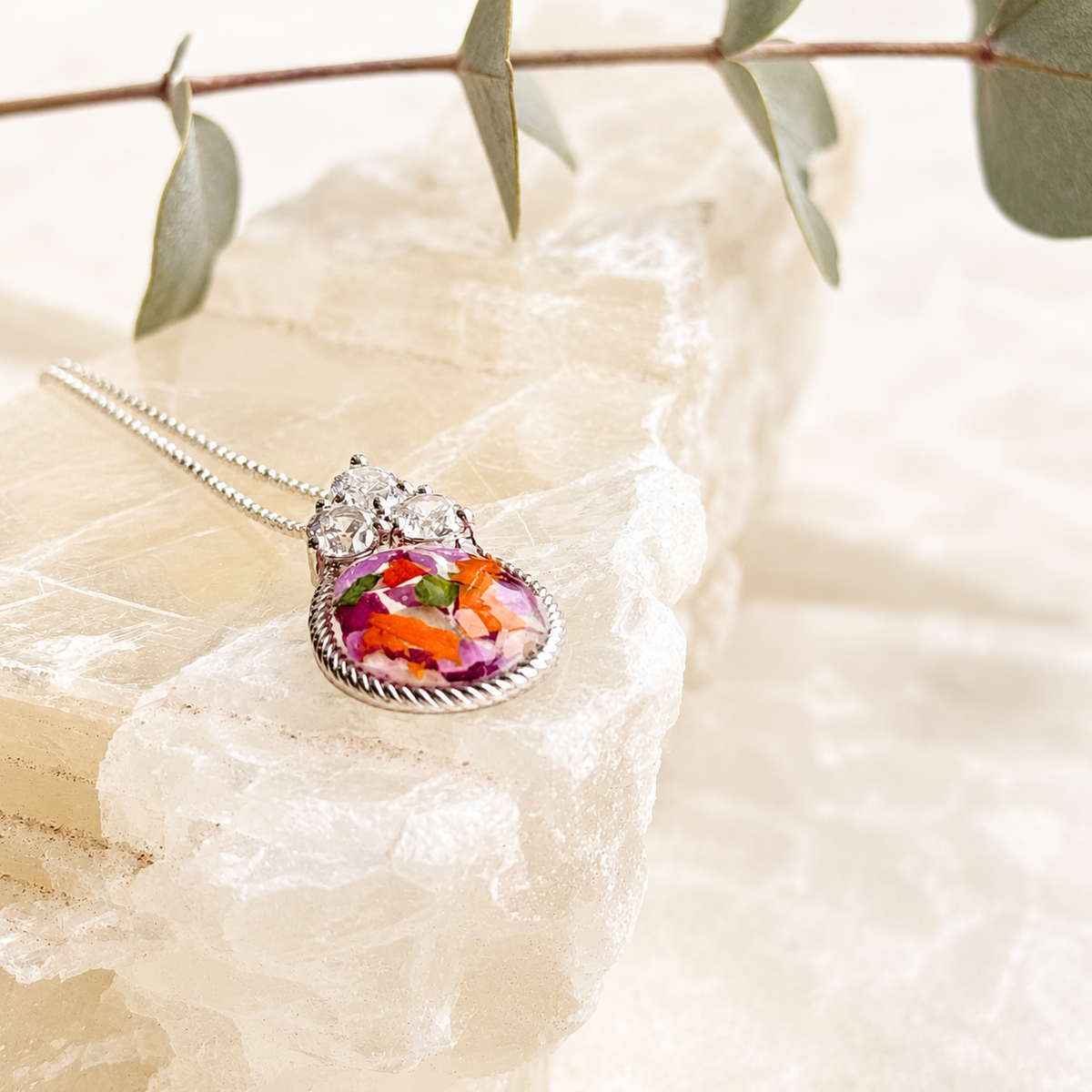 Forever in My Heart Pendant with colorful preserved flowers in a silver setting.
