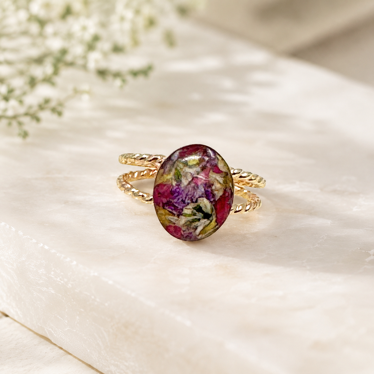 Rosevine Keepsake Ring with colorful preserved flowers in a gold setting.