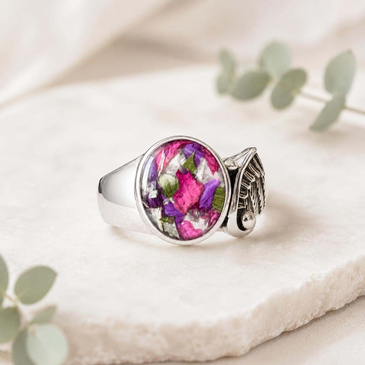 Seraphina Memorial Ring with pink and purple preserved flowers in a silver setting.
