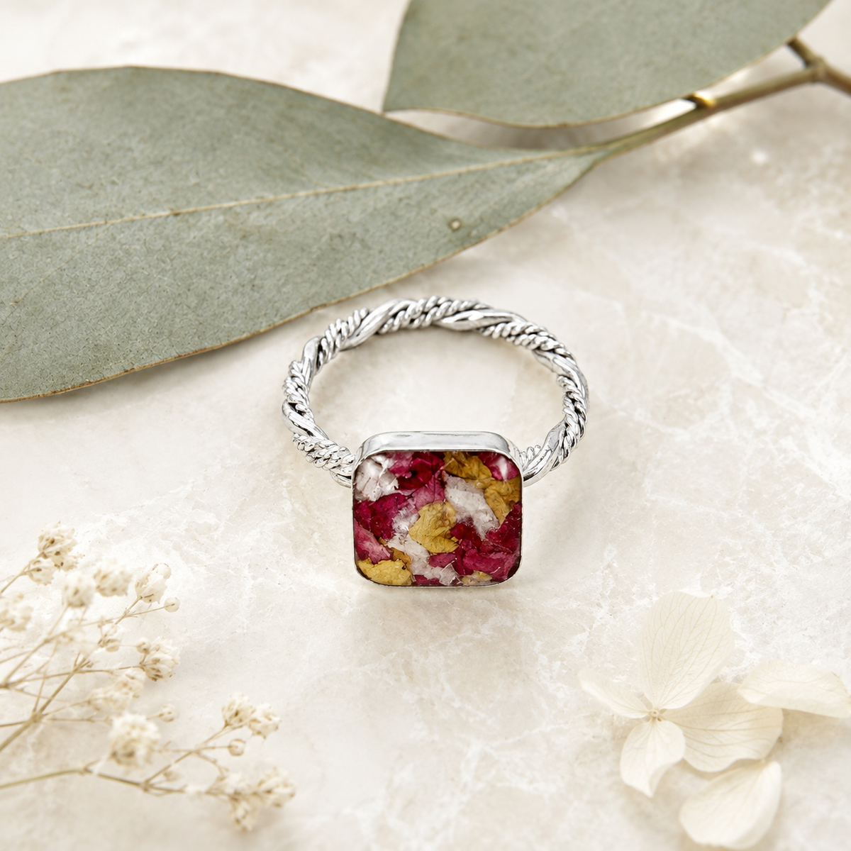 Square Memorial Flower Ring with red, yellow and white preserved flowers shown from the side.
