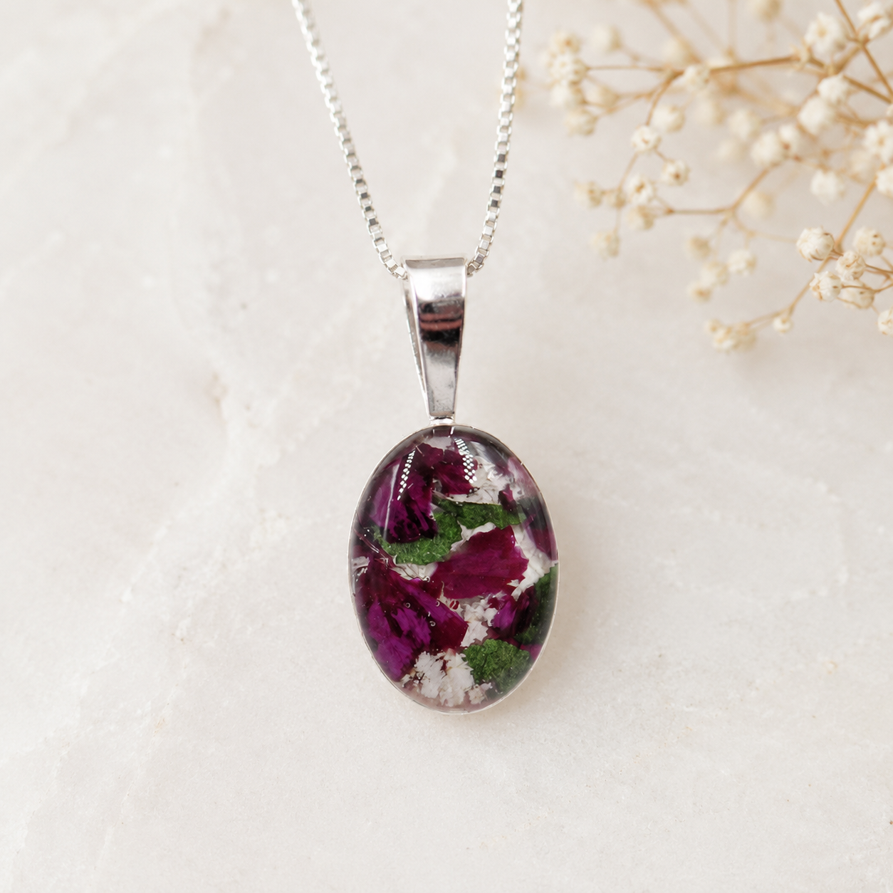 Timeless Floral Keepsake with burgundy, white and green preserved flowers.