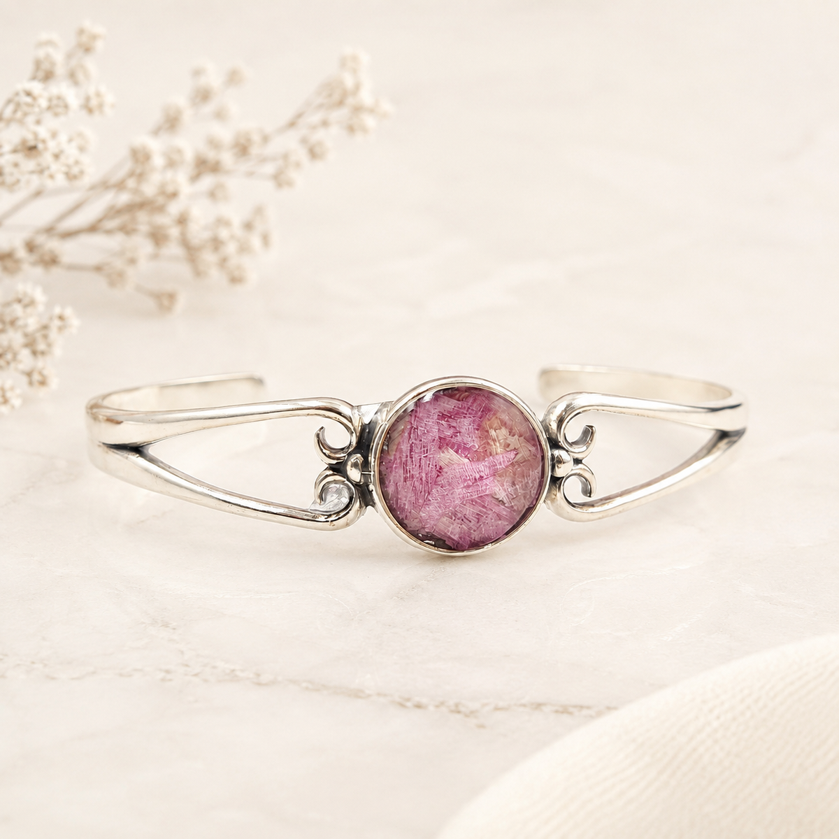 Unity Memorial Bracelet with pink preserved flowers in a silver setting.