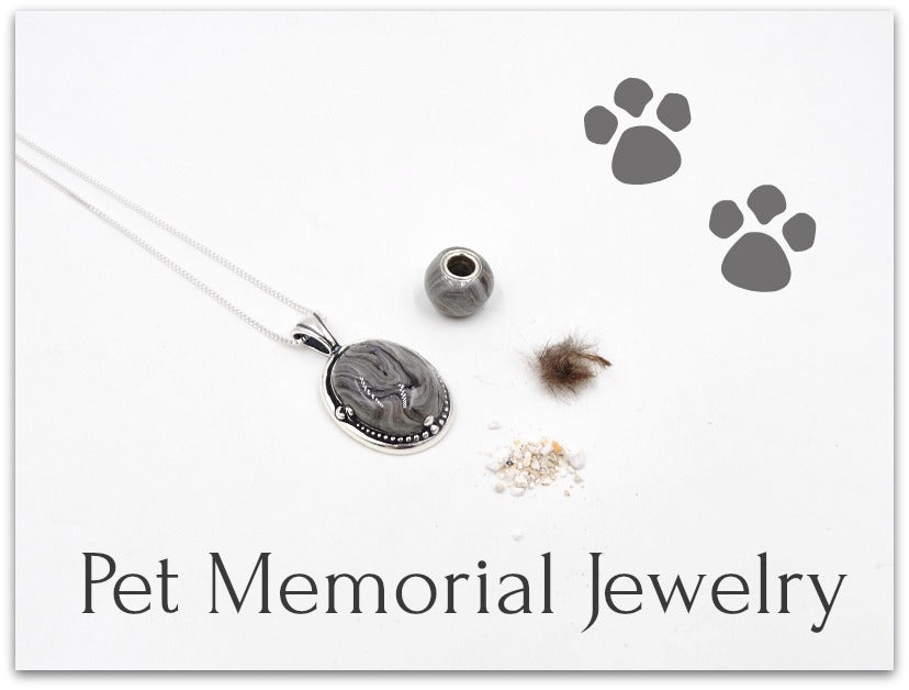 A pet memorial pendant and matching charm, both infused with ashes or fur, shown with the original ashes and fur used in the creation process. A custom keepsake designed to cherish a beloved pet’s memory.