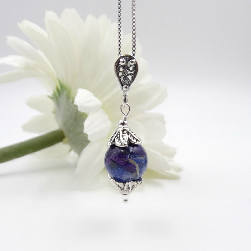 Dried flowers can be added to this pendant from a memorial, birthday, wedding or special event. 