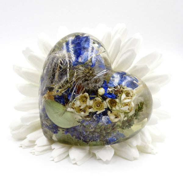 Large resin heart completely filled with colorful, pressed flowers.