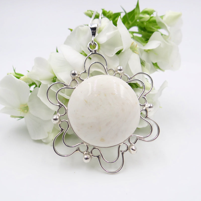 Dried white roses handmade into memorial jewelry 
