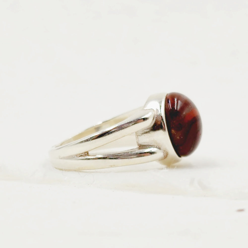 A side view of the Daisy Pet Memorial Ring, showcasing its handcrafted design and smooth, elegant finish.