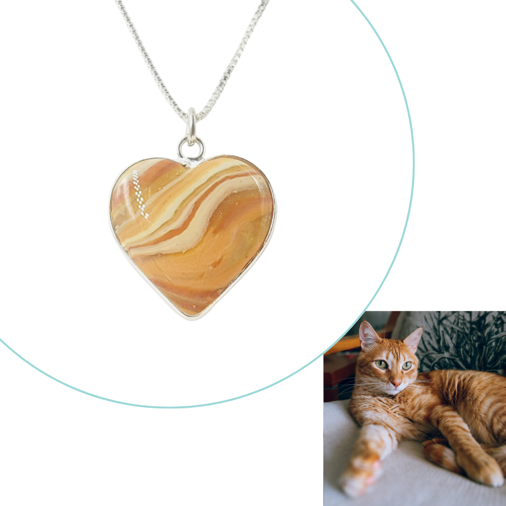 Custom heart-shaped pet memorial pendant infused with ashes or fur, designed to match a pet’s unique fur color.